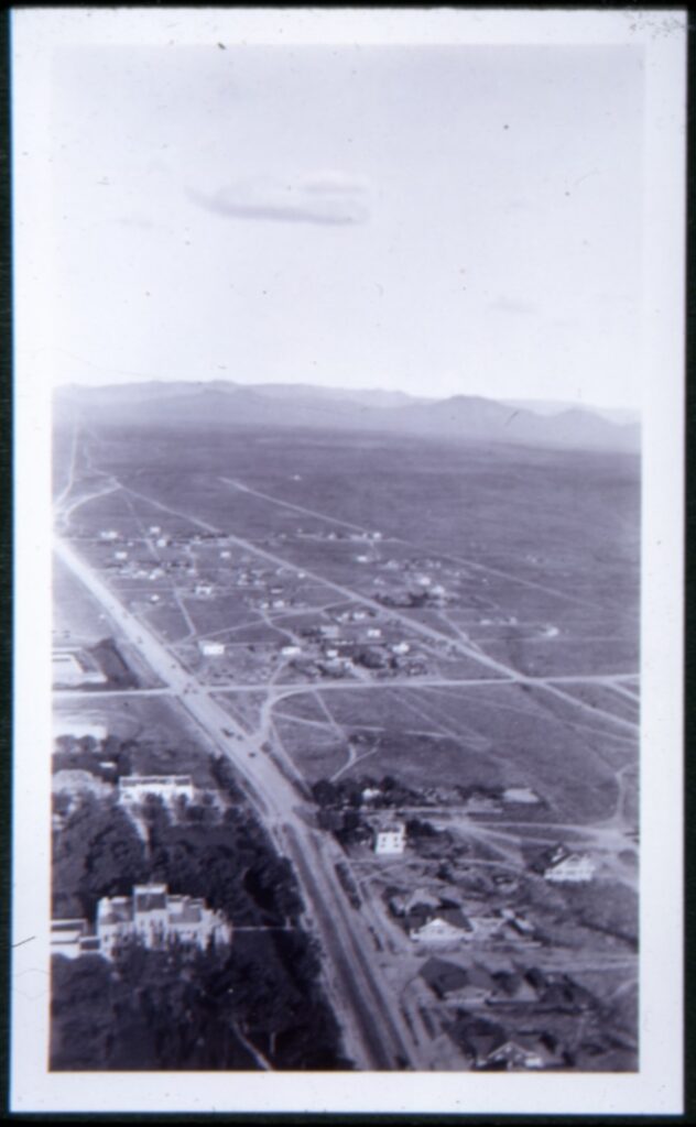 Black and white aerial photograph looking toward Sandias showing limited development south of Central Avenue.
